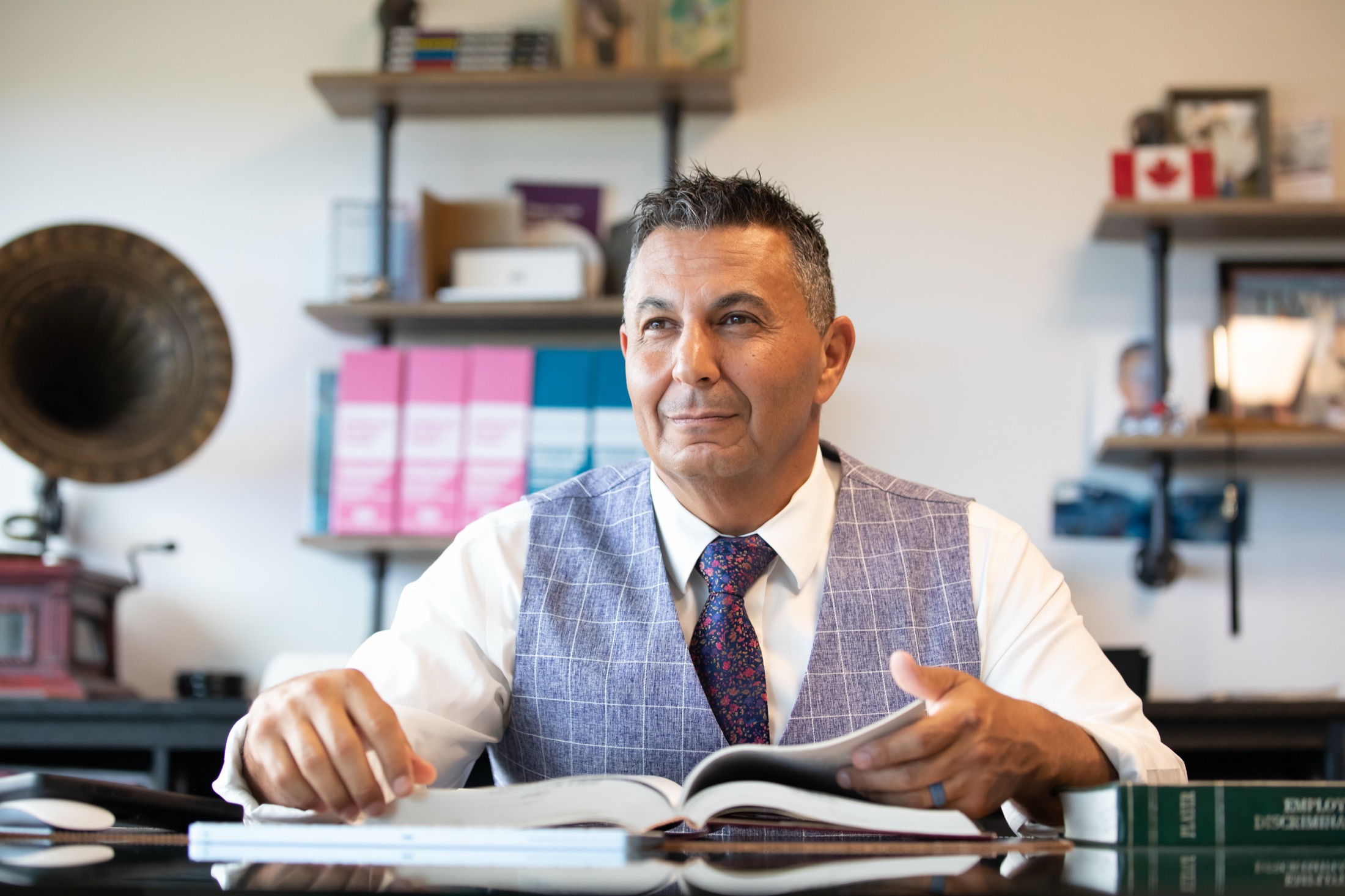 Andrew Obeidy, Esq. reviewing employment law material in his office